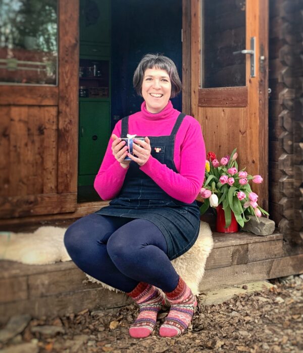 Ruth sitting on the cabin step